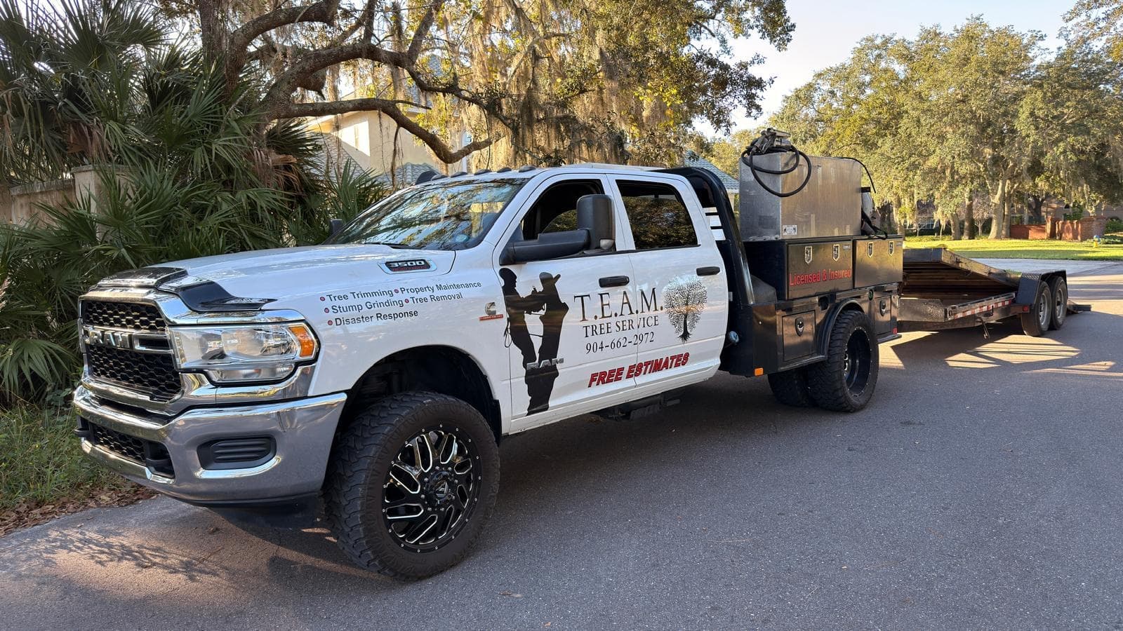 T.E.A.M. Tree Service owner's RAM 3500 work truck with trailer